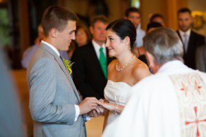 bride and groom exchanging rings in church – Incline Village St Francis of Assisi wedding photography