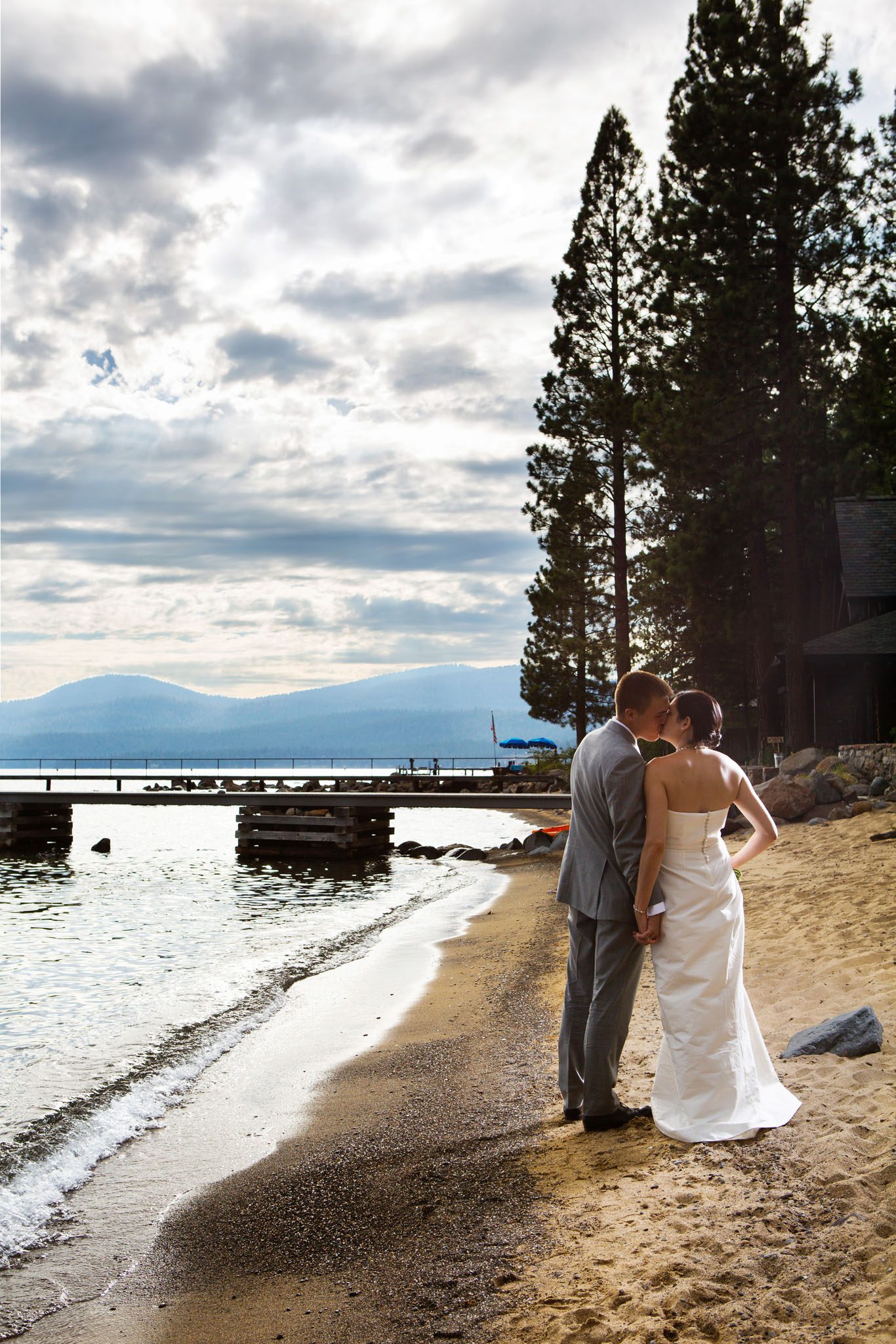 bride and groom on beach kissing – North Lake Tahoe Kings Beach wedding photography