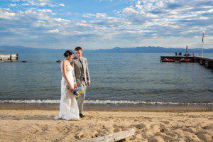 bride and groom walking on beach – North Lake Tahoe Kings Beach wedding photography