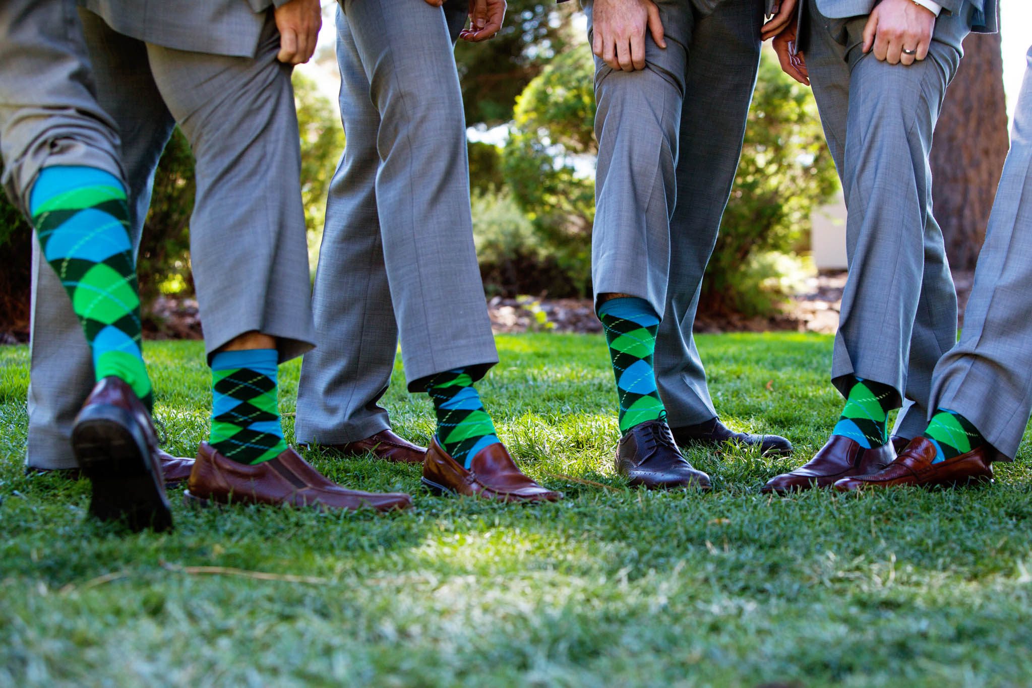groomsmen showing off socks – Lake Tahoe Hyatt Persian American wedding photography