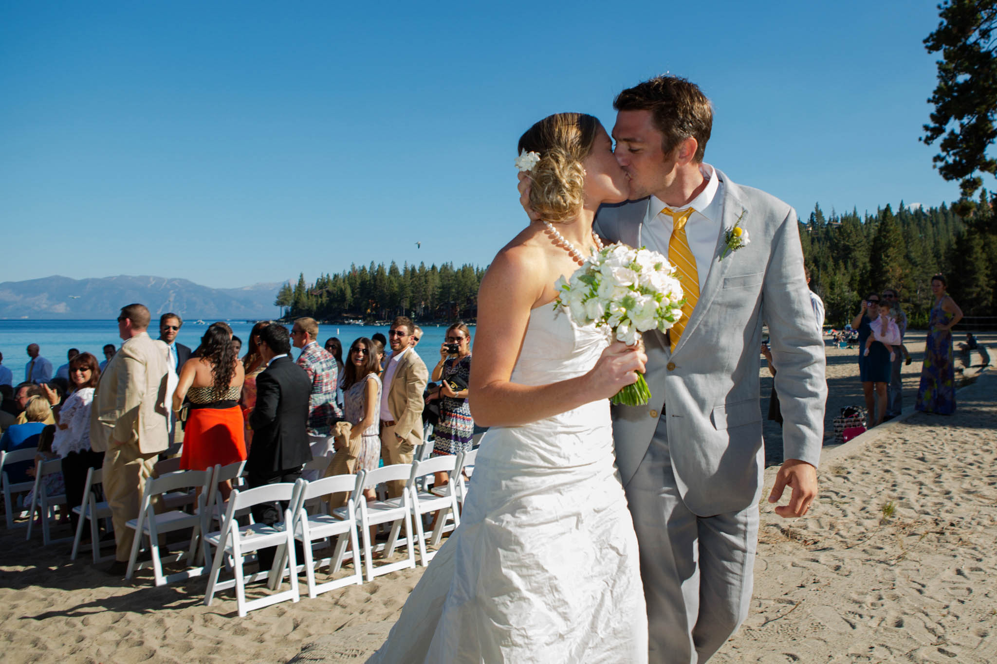 bride and groom kissing after ceremony – Lake Tahoe Meeks Bay wedding photography