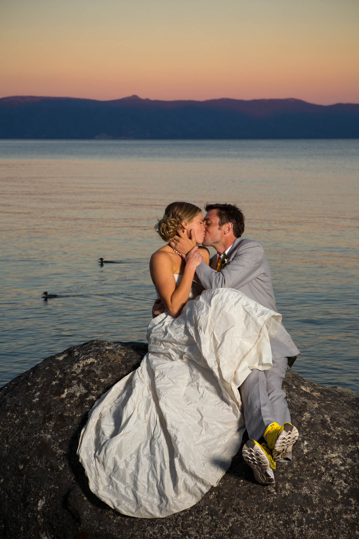bride and groom sunset portrait on rocks – Lake Tahoe Meeks Bay wedding photography