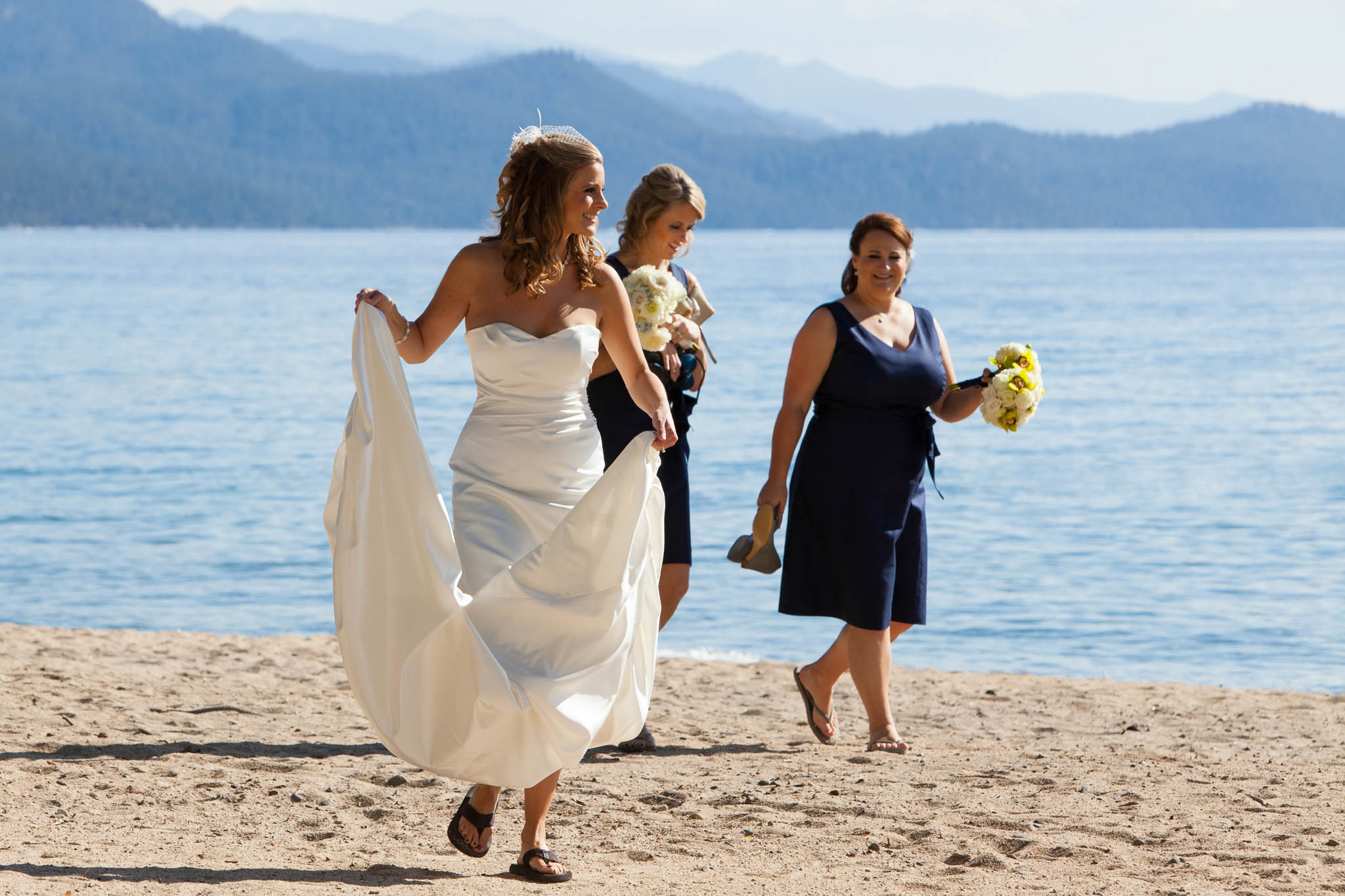 bride walking on beach laughing Hyatt Tahoe – nina wedding photographer