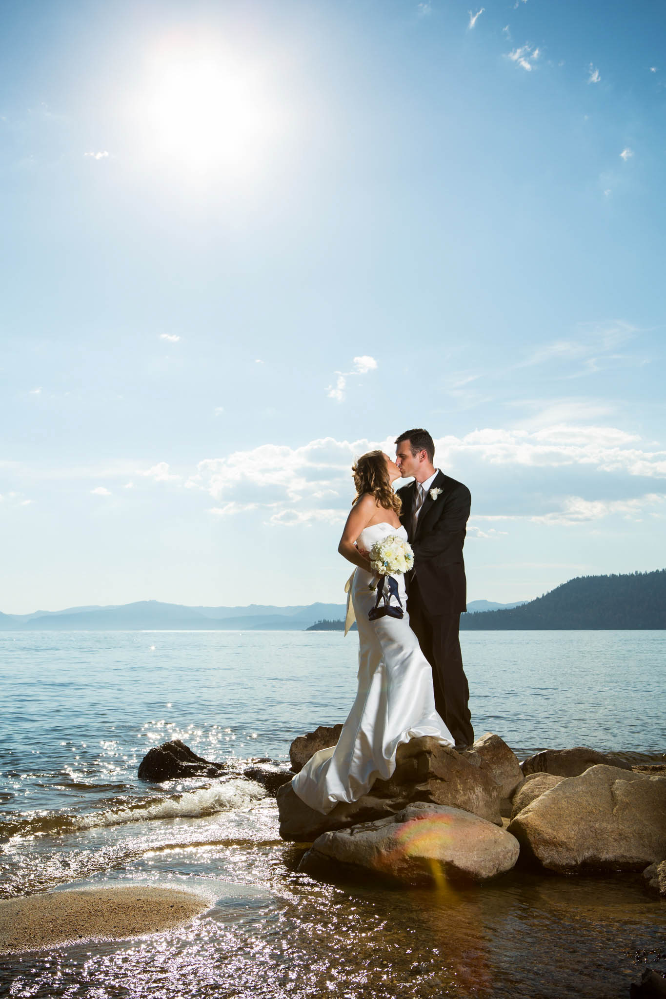 bride and groom portrait on rocks beach Hyatt tahoe – nina wedding photographer