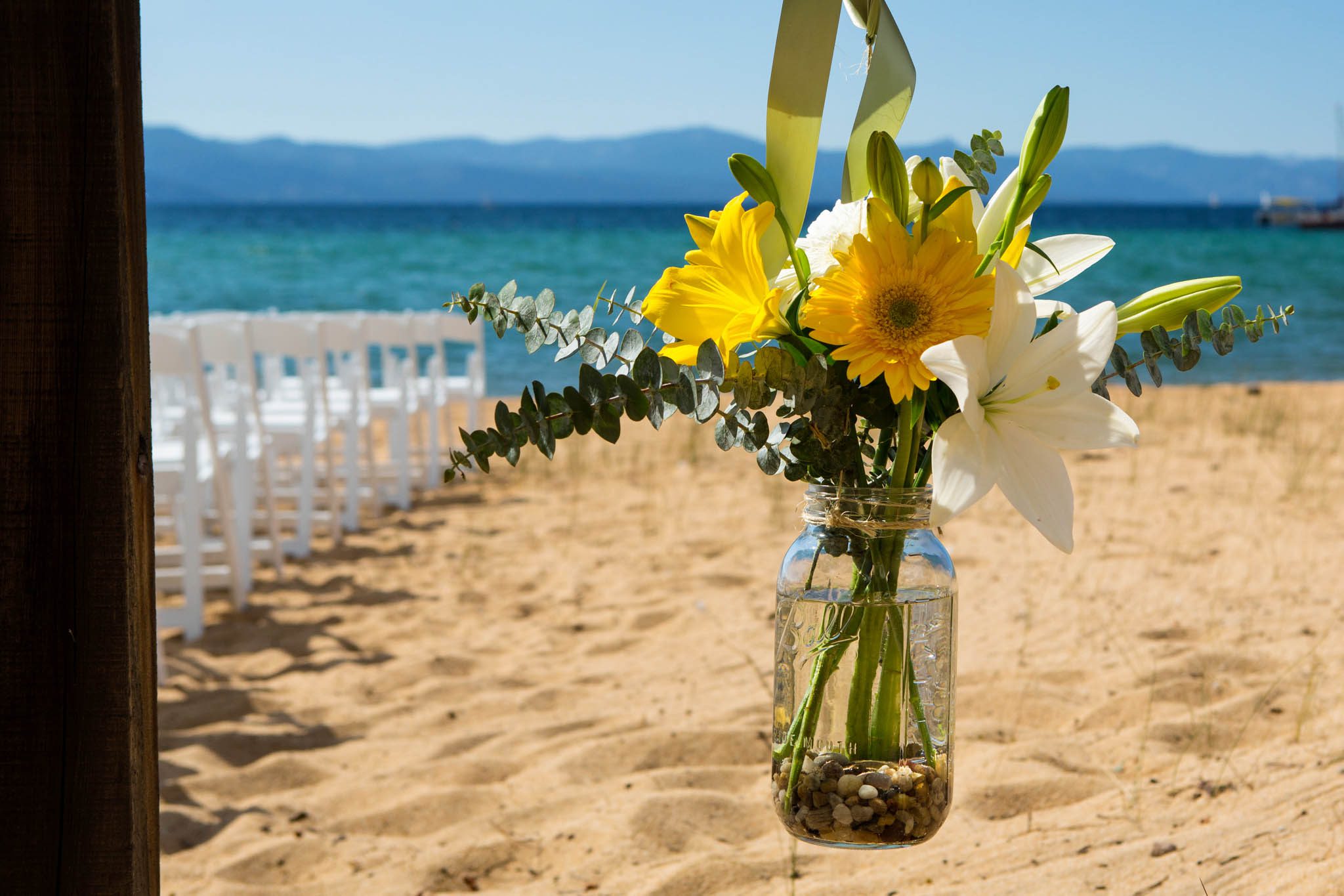 ceremony set-up, chairs, flowers – South Lake Tahoe lakefront beach wedding nina photographer