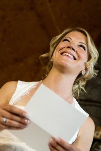 bride reading letter from groom – South Lake Tahoe lakefront beach wedding nina photographer