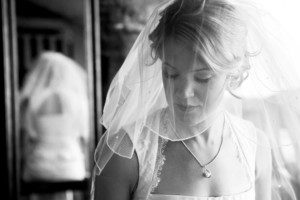 bride getting ready, reflecting, waiting – South Lake Tahoe lakefront beach wedding nina photographer