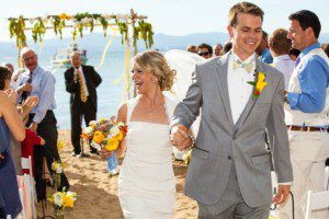 bride and groom recession, laughing – South Lake Tahoe lakefront beach wedding nina photographer