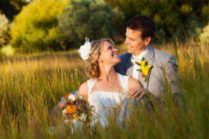 bride and groom portrait, looking at one another, in meadow, tall grass – South Lake Tahoe lakefront beach wedding nina photographer