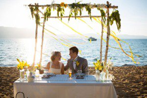 bride and groom laughing during reception – South Lake Tahoe lakefront beach wedding nina photographer