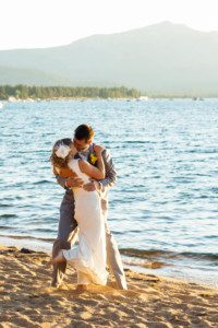 bride and groom dancing, kissing on beach – South Lake Tahoe lakefront beach wedding nina photographer