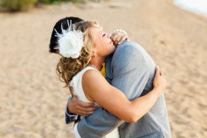 bride and groom intimate hug – South Lake Tahoe lakefront beach wedding nina photographer