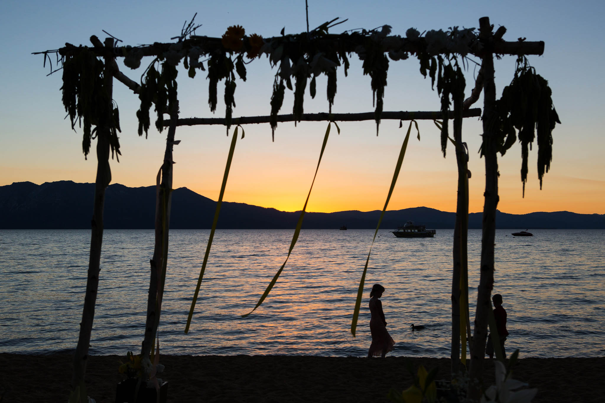 sunset behind arch – South Lake Tahoe lakefront beach wedding nina photographer