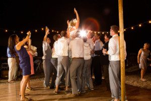 bride lifted on dancefloor, reception – South Lake Tahoe lakefront beach wedding nina photographer