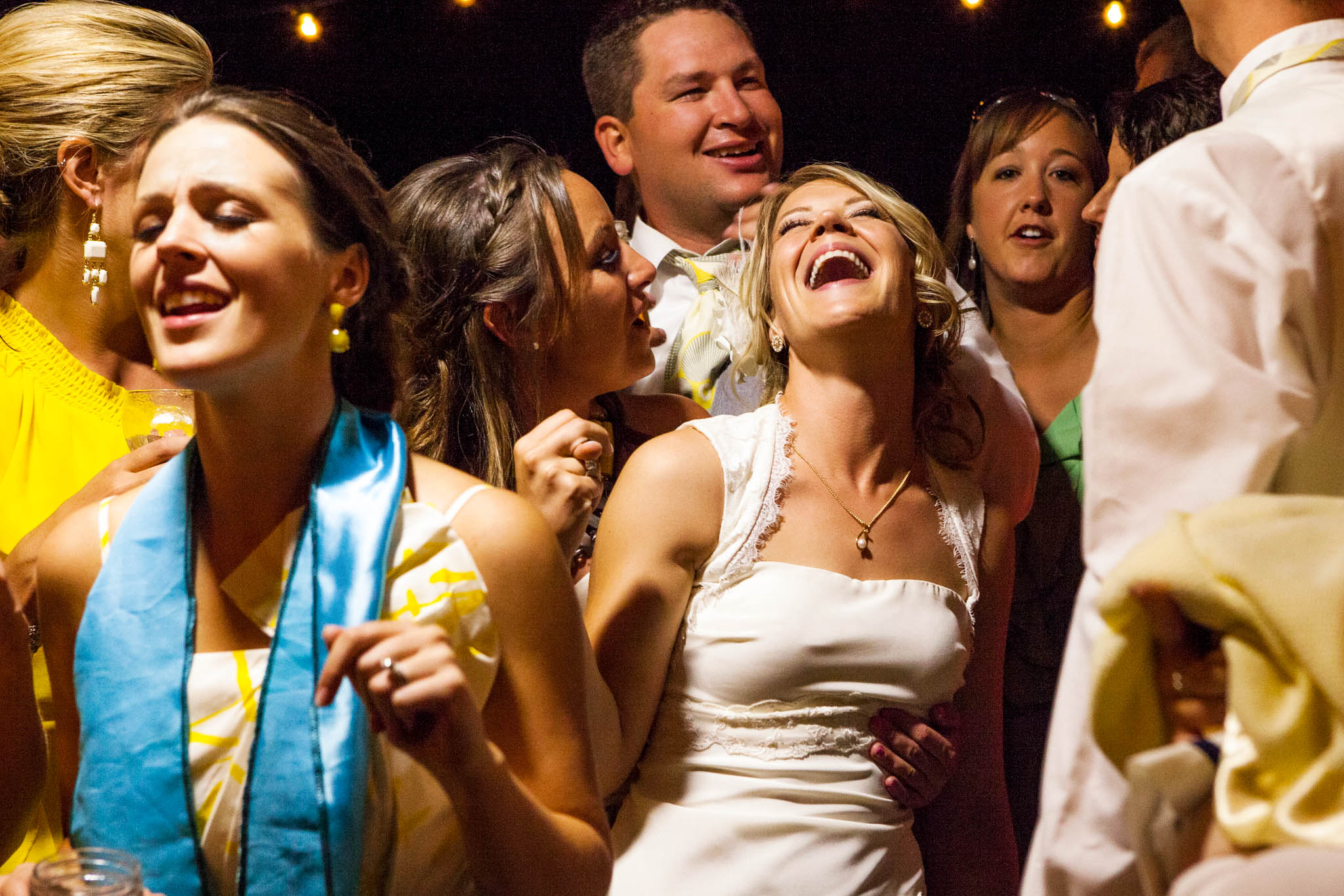 bride laughing and dancing at reception – South Lake Tahoe lakefront beach wedding nina photographer