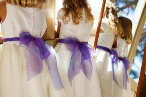 flower girls peeking out window – Fairwinds Tahoe wedding photography
