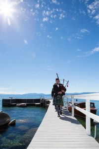 bag piper groomsmen walking on pier – Fairwinds Tahoe wedding photography
