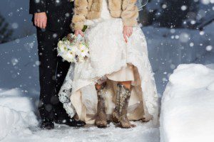 winter wedding bride groom snow boot detail