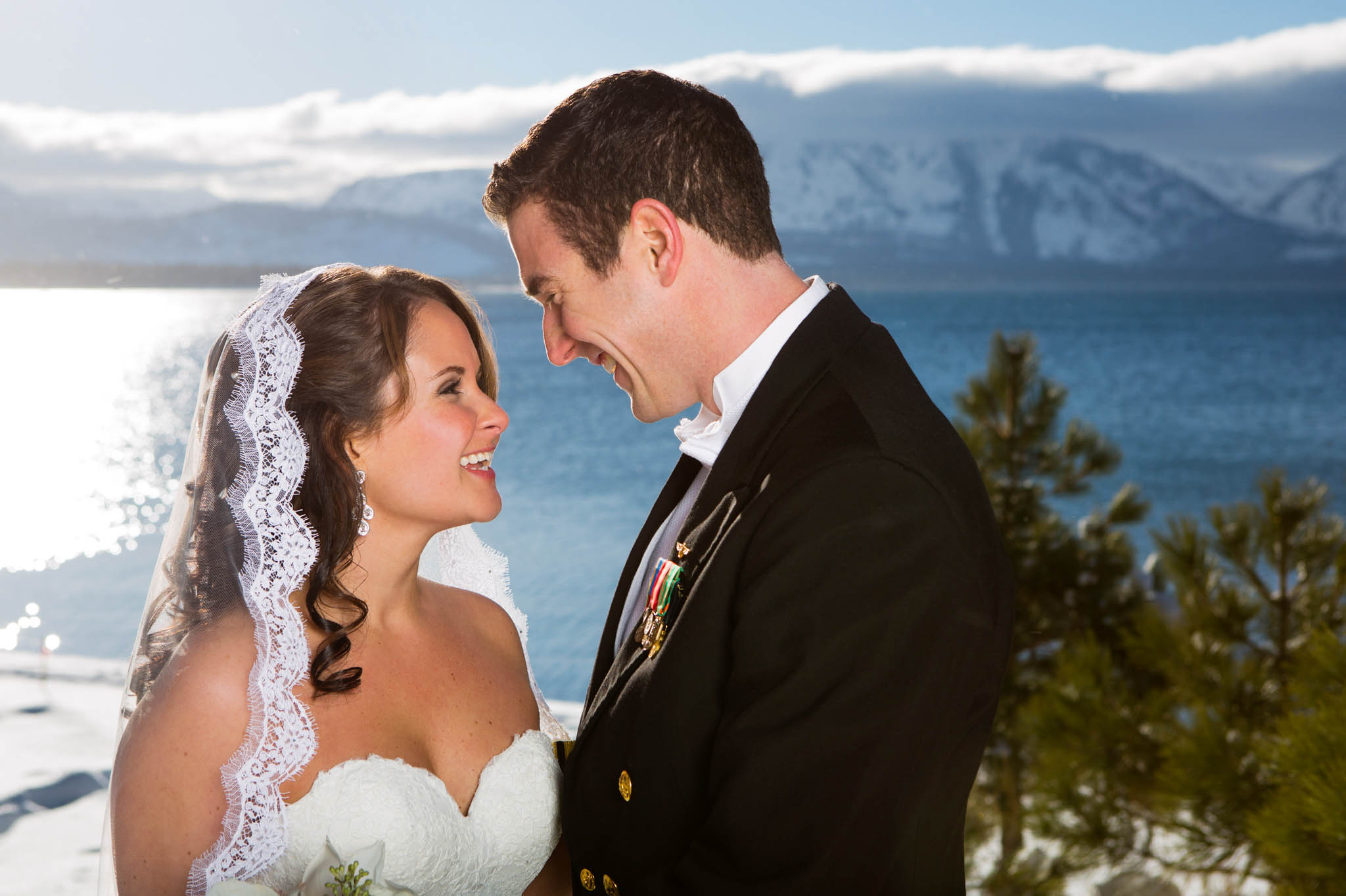 bride and groom close-up, candid, laughing, lake view, snow, uniform