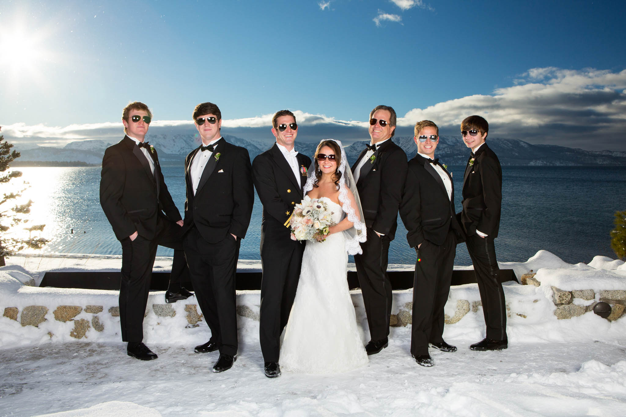 bride, groom, groomsmen, smiling, sunglasses, white bouquet, snow, winter, lake, blue