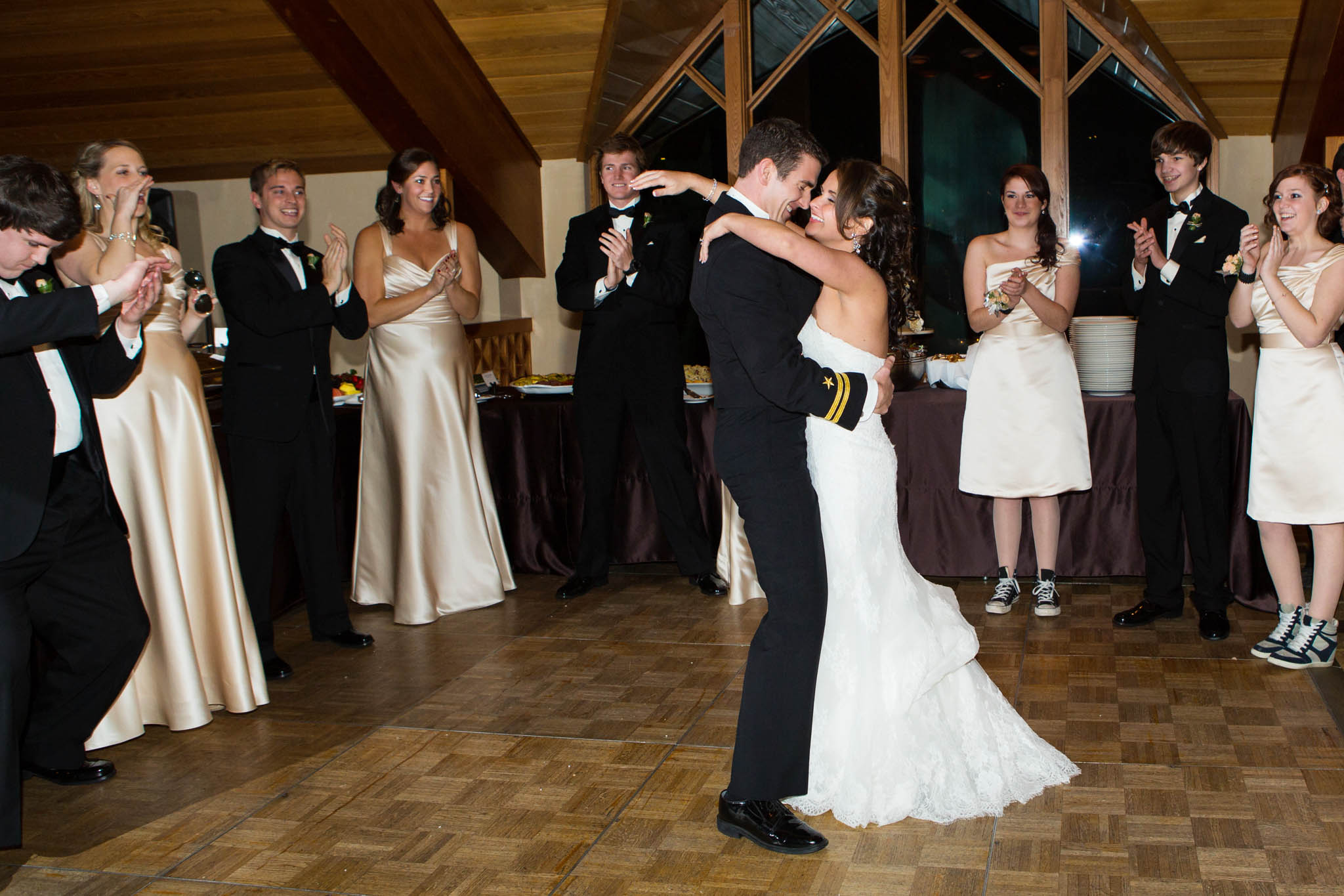 bride and groom introduction, hugging, laughing, bridal party, dance floor