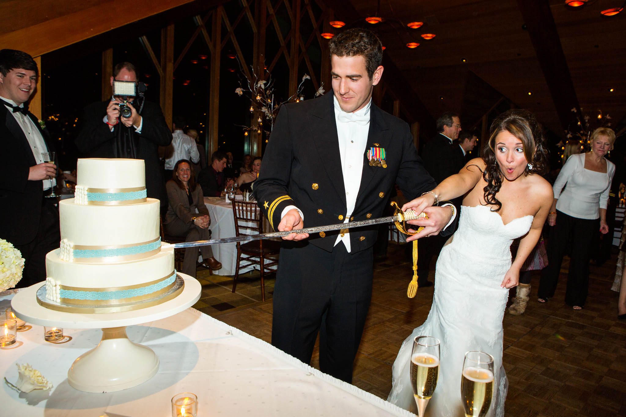 bride and groom, cake cutting, saber, funny face
