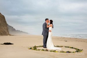 bride groom on beach ocean portrait photographer