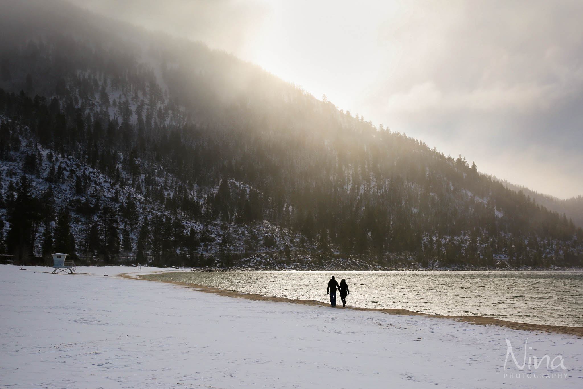 couple walking on beach, silhouette, golden light